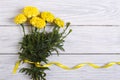 Bouquet of yellow marigold with ribbon