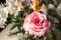 Bouquet of yellow-pink rose with Alstroemerias and silver fir twigs Royalty Free Stock Photo