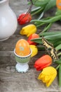 Bouquet of yellow and red tulips and easter eggs Royalty Free Stock Photo