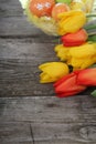 Bouquet of yellow and red tulips and easter eggs Royalty Free Stock Photo