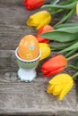 Bouquet of yellow and red tulips and easter eggs Royalty Free Stock Photo