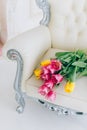 Bouquet yellow and rose tulip vintage chair in white room