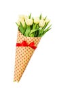 Bouquet of yellow spring tulips wrapped in paper with hearts. Isolated over white