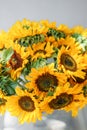 Bouquet of yellow sunflowers , flower in vase on old vintage table. Room morning. Gray background. Colors of autumn and Royalty Free Stock Photo
