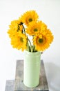 Bouquet of yellow sunflowers , flower in vase on old vintage table. Room morning. Gray background. Colors of autumn and Royalty Free Stock Photo