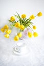 Bouquet of yellow tulips vase on the table Royalty Free Stock Photo