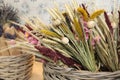 Bouquets of beautiful dried flowers plants - chrysanthemums, lavender, poppies, wheat spikelets in the greek flowers bar.