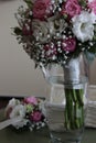Bouquets of brides and bridesmaids from white roses and red peonies, white eustomas and gypsophila Royalty Free Stock Photo