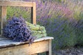 Bouquets on lavenders on a wooden old bench