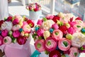 Bouquets of paper flowers in a round cardboard boxes