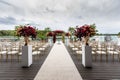 Bouquets of roses placed in vases for the decor on the wedding day. Great location for the outdoor ceremony. Royalty Free Stock Photo