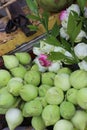 Bouquets of white and pink lotus flowers are sold near the temple