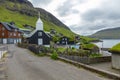 Bour village. Typical grass-roof houses and green mountains. Vagar island, Faroe Islands. Denmark. Europe