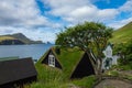 Bour village. Typical grass-roof houses and green mountains. Vagar island, Faroe Islands. Denmark. Europe