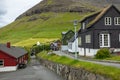 Bour village. Typical grass-roof houses and green mountains. Vagar island, Faroe Islands. Denmark. Europe