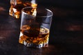 Bourbon in glass, american corn whiskey, dark bar counter, selective focus