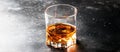 Bourbon in glass, american corn whiskey, dark bar counter, selective focus