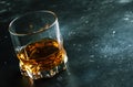 Bourbon in glass, american corn whiskey, dark bar counter, selective focus