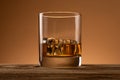 Bourbon in glass, american corn whiskey, light bar counter, selective focus
