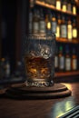 Bourbon or whisky glass on dark woody background, close up