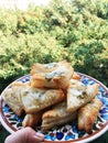 Bourekas cheese pastry, triangular Israeli bureks with cheese on a plate