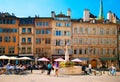 Bourg-de-four square with people sit in cafe and restaurants.