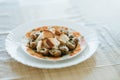 Bourgogne Escargot Snails with garlic, cheese with herbs butter in a creamy sauce with bread on white plate. Side view. French tr Royalty Free Stock Photo