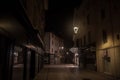 Rue de la Liberte, a dark & empty pedestrian street with traditional French architecture buildings in a commercial downtown zone