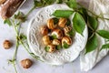 Bourguignonne snail with lemon. Marble background. French cuisine Royalty Free Stock Photo