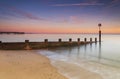 Bournemouth beach illuminated by the setting sun at sunset Royalty Free Stock Photo