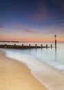 Bournemouth beach illuminated by the setting sun at sunset Royalty Free Stock Photo