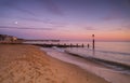 Bournemouth beach illuminated by the setting sun at sunset Royalty Free Stock Photo