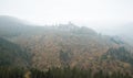 Bourscheid castle in fog, autumn colors