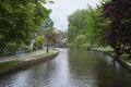 Stone footbridge across the River Windrush in Bourton-on-the-Water, also known as The Venice of the Cotswolds - Gloucestershire - Royalty Free Stock Photo