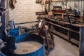 BOURTON-ON-THE-WATER, GLOUCESTERSHIRE/UK - MARCH 24 : Old Workshop in the Motor Museum at Bourton-on-the-Water in Royalty Free Stock Photo