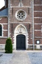 Boutersem, Flemish Brabant Region, Belgium - Decorated brick stone facade of the Saint Andrew catholic church