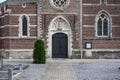 Boutersem, Flemish Brabant Region, Belgium - Decorated brick stone facade of the Saint Andrew catholic church
