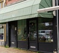 Boutique bakery `Majesteit Taart` in Amsterdam, Netherlands. Cakes, coffee, sweets and High tea. Outside view of window of the c