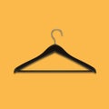 Boutique shop black clothes hanger on yellow background