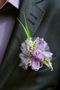Boutonniere flower in the pocket of the groom on wedding ceremony Royalty Free Stock Photo