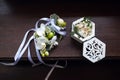 Boutonniere for the groom and a decorative wedding box with wedding gold rings Royalty Free Stock Photo