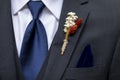 Boutonniere, tie, and handkerchief detail shot on the suit of a groom or groomsman Royalty Free Stock Photo