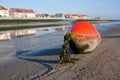 Bouy lying on the coast Royalty Free Stock Photo
