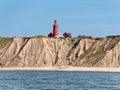 Bovbjerg lighthouse and cliffs from North Sea, Ferring, Lemvig, Mid Jutland, Denmark Royalty Free Stock Photo