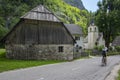 Bovec, Trenta Valley, Slovenia - July 6, 2022: picturesque houses with old Lady of Loreto Church surrounded with greenery