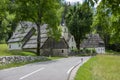 Bovec, Trenta Valley, Slovenia - July 6, 2022: picturesque houses with old Lady of Loreto Church surrounded with greenery