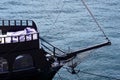 Bow of a black sailing yacht against the blue sea with anchor at the bow. copy space, selective focus, narrow depth of field. Royalty Free Stock Photo