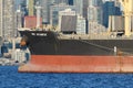 Bow of bulk carrier cargo ship HPC Atlantic in Elliott Baty Seattle with buildings