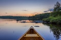 Bow of a cedar canoe on a lake at sunset - Ontario, Canada Royalty Free Stock Photo