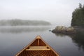 Bow of a Cedar Canoe on a Misty Lake